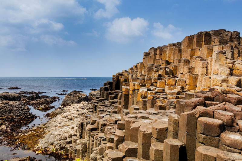 Rocks in tall, angular pillar formations next to the ocean